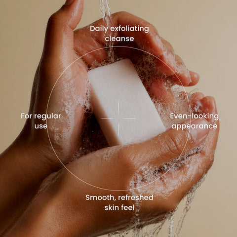 Koji White AHA exfoliating soap bar, 0.88 oz, four bars, with natural ingredients, visible exfoliating texture and packaging.