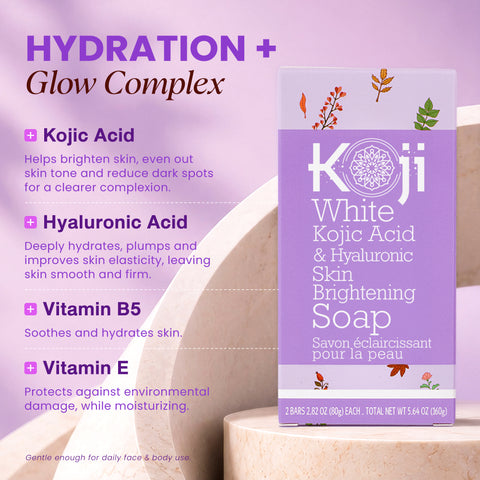 Two bars of kojiwhite Kojic Acid and Hyaluronic Acid brightening soap, featuring smooth, white soap with branding on the packaging.