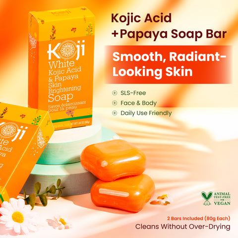 Two bars of Kojiwhite Kojic Acid and Papaya Skin Brightening Soap with papaya extract, shown in a clear view.