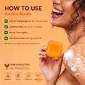 Two bars of Kojiwhite Kojic Acid and Papaya skin brightening soap with fresh papaya slices and soap bars on a white background.
